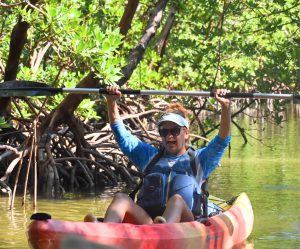 a woman sitting on a boat in the water