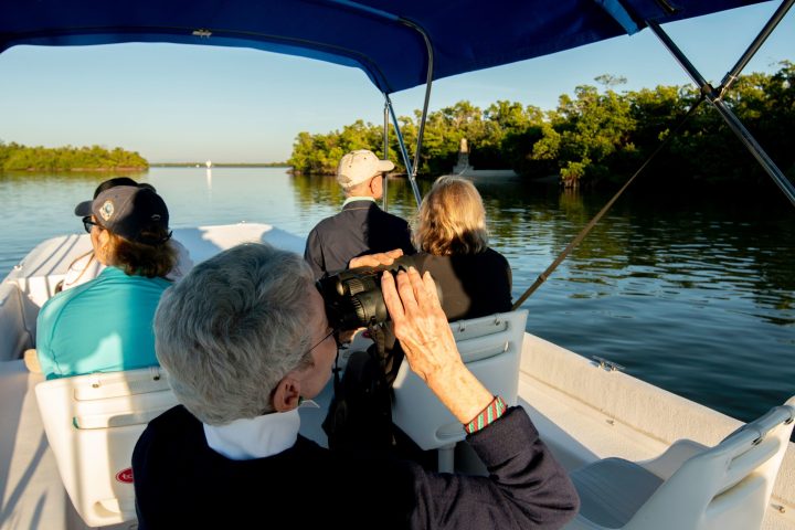 a person sitting on a boat in the water